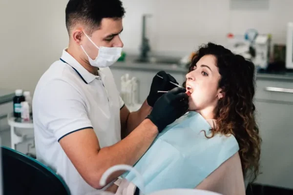 dentist-checking-patient-office